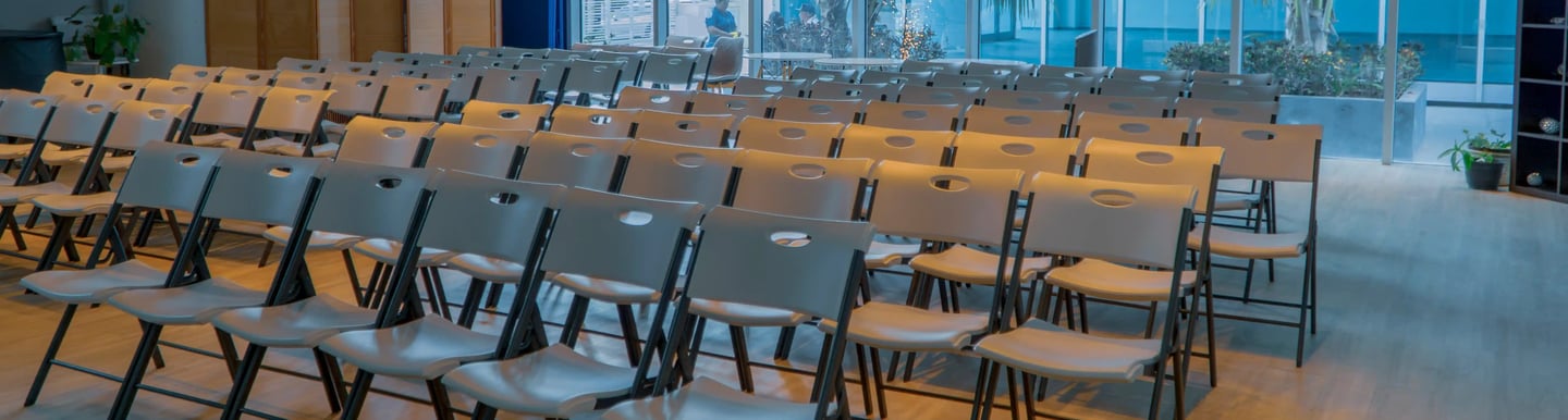 a room with chairs and tables and chairs