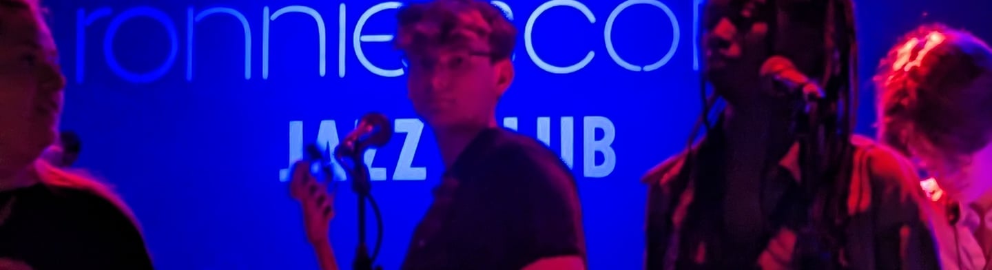 An image of Jamie Walker playing Electric Bass at Ronnie Scott's Jazz Club in London