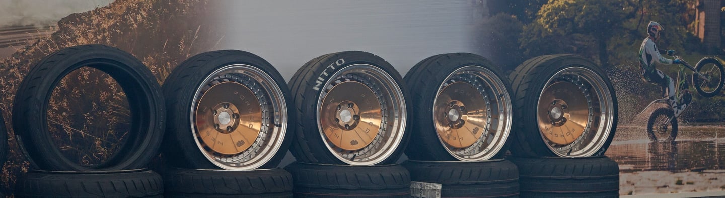 A line of wheels against a wall
