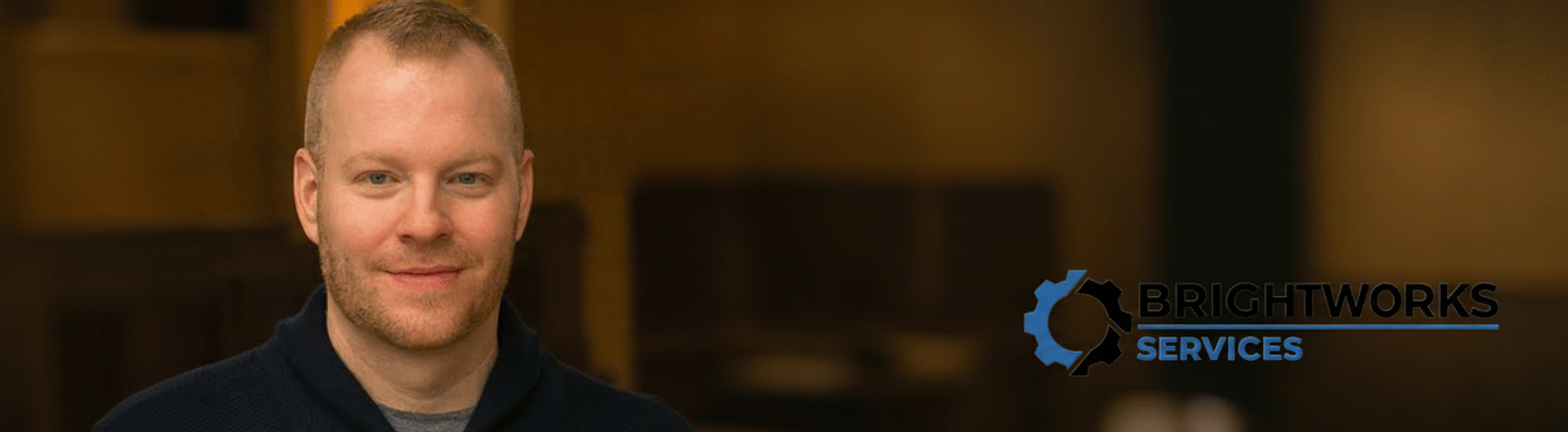 a man in a blue sweater with the brightworks services logo 