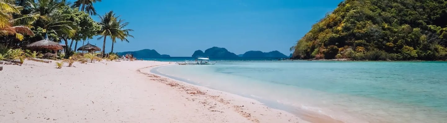 Pristine sandbar and turquoise waters in Balabac – the ultimate Palawan island expedition.