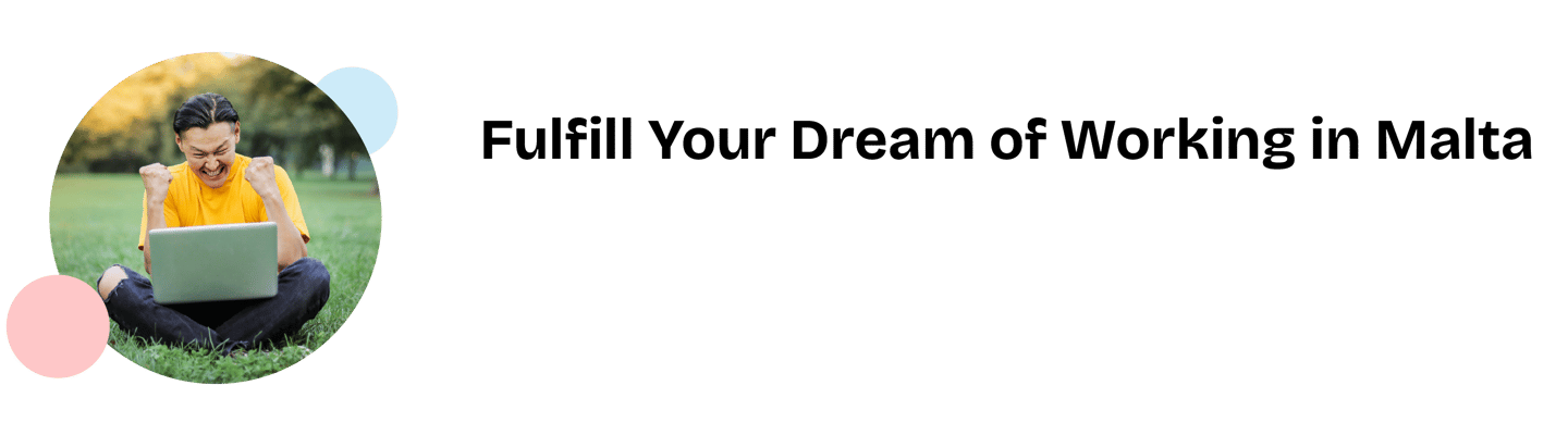 a man sitting on a laptop computer in a field