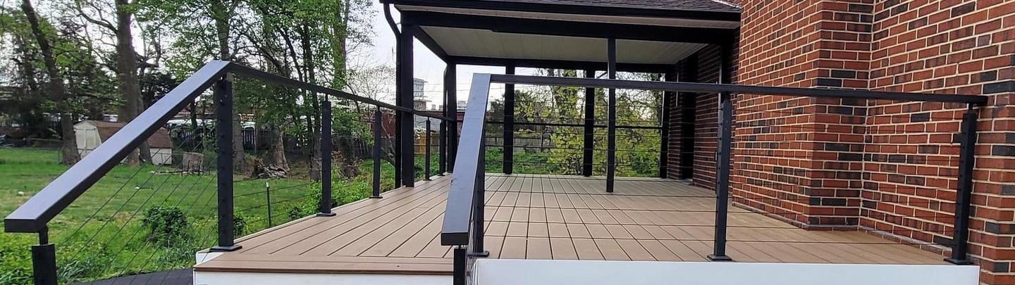 New deck replacement with composite decking and metal railing in Northern Virginia by The Great Hous