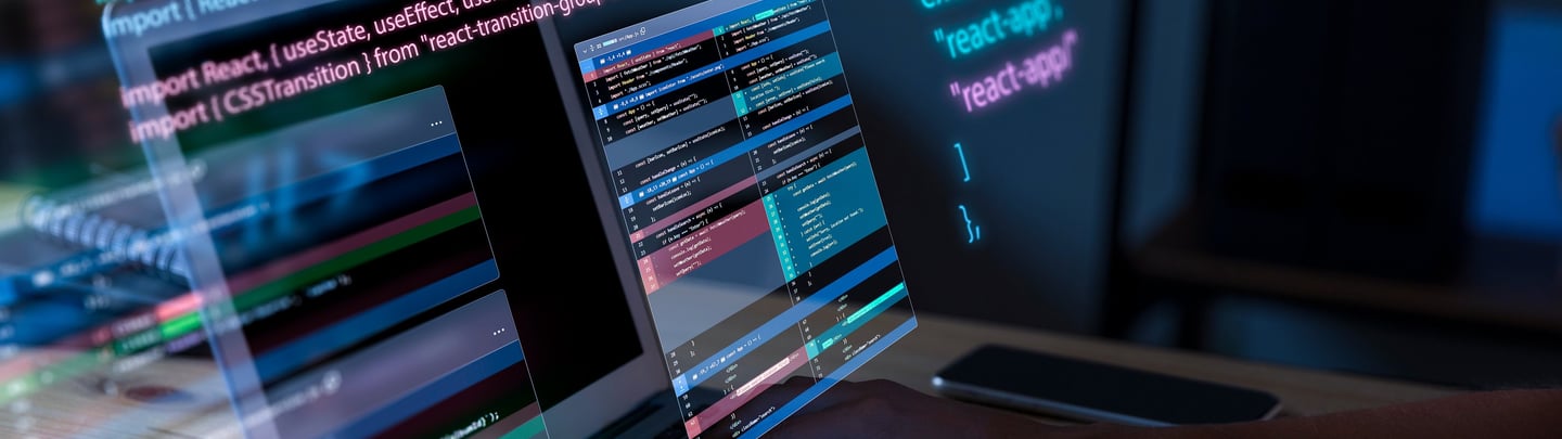 a person typing on a laptop computer screen