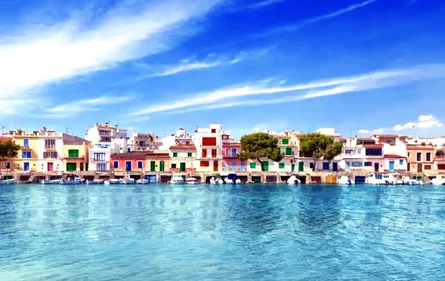 a view of a city with a boat in the water