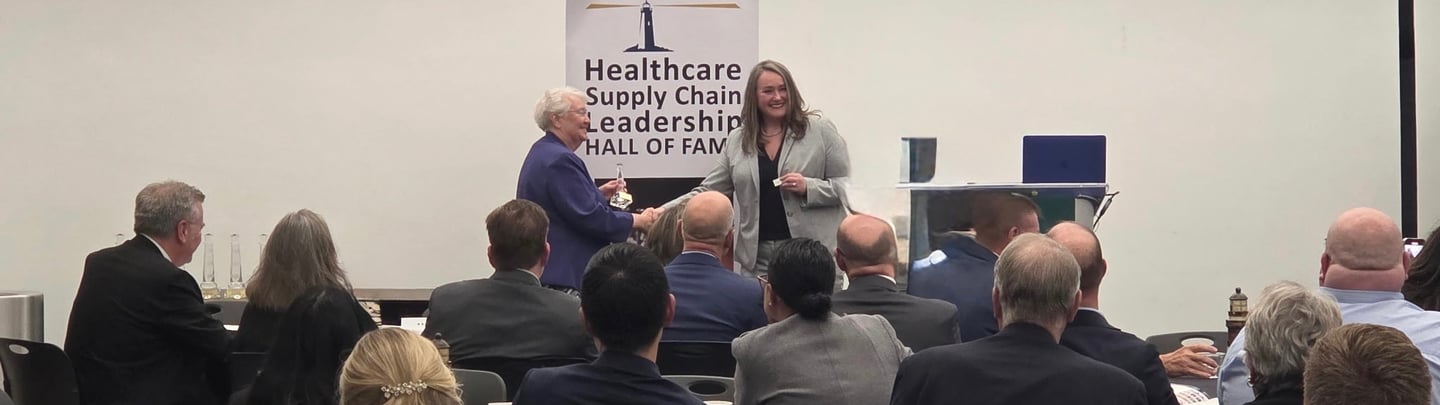 Healthcare Supply Chain Leadership Hall of Fame awards ceremony with speakers presenting to an audience.