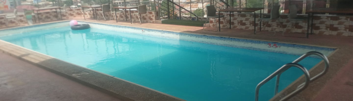 nim avenue pool with a swimming pool and a swimming bar pool