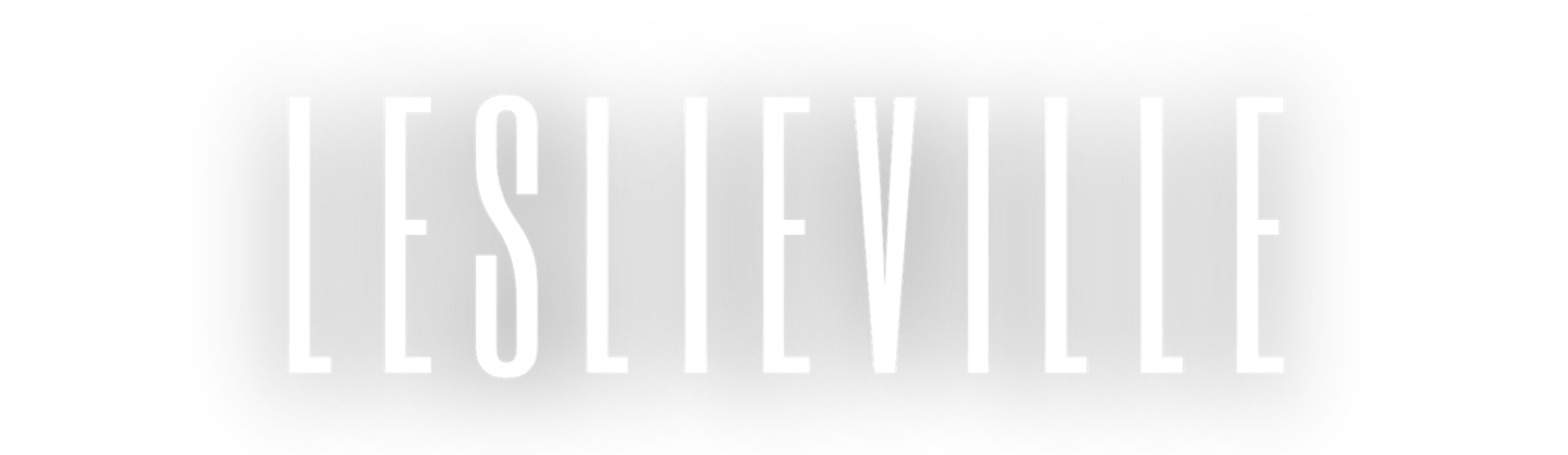 Leslieville neighborhood logo in white tall sans-serif typography on a black background.
