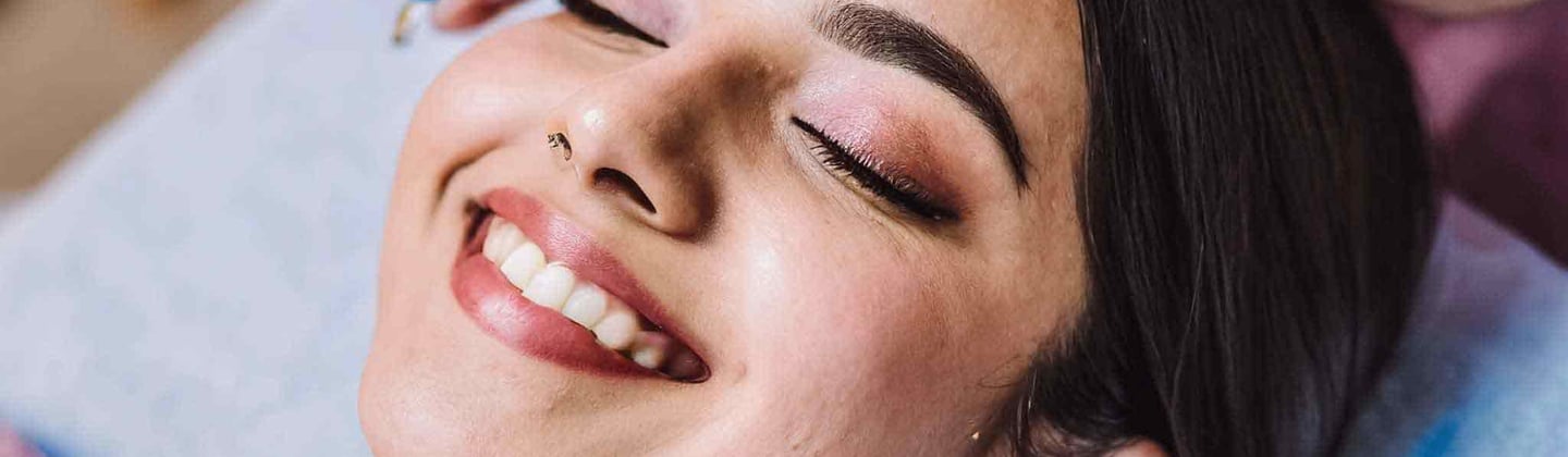 a woman getting her facial massage on the face