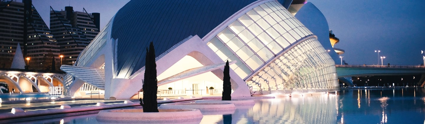 a building with a large glass window and a large building