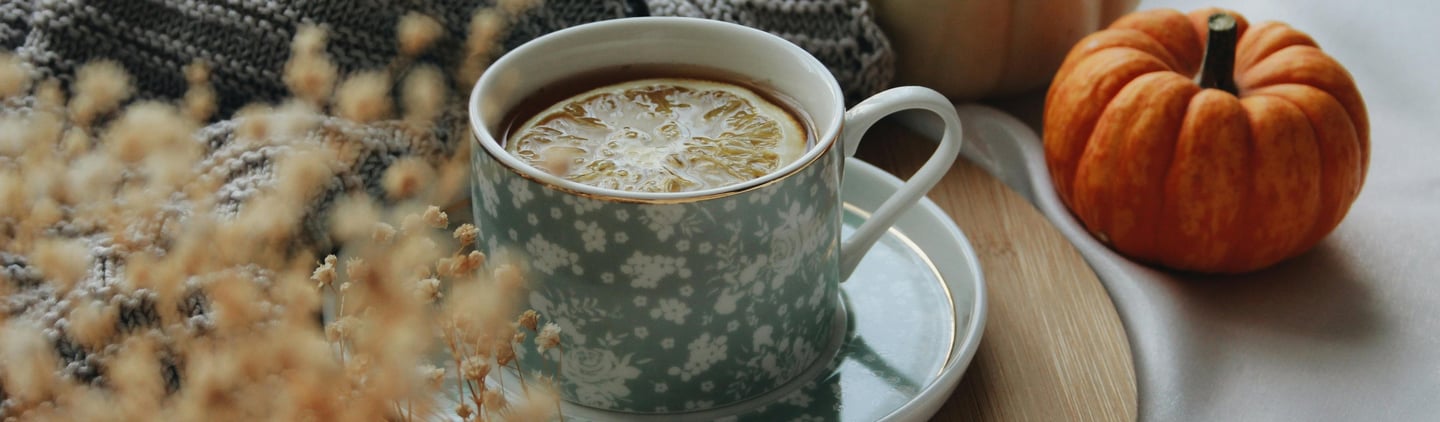 a cup of coffee and a pumpkin spiced up