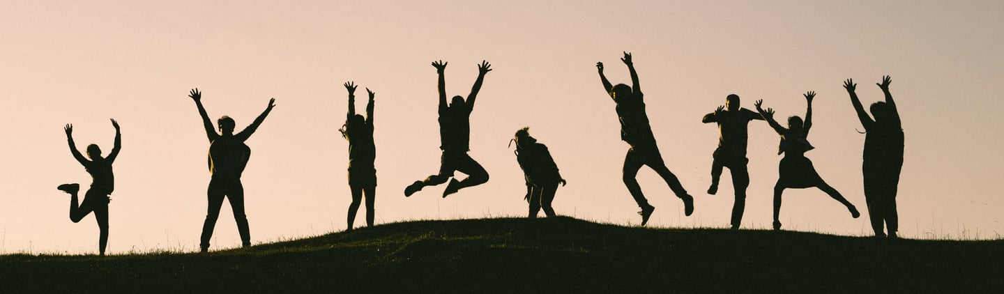 People feeling empowered, jumping for joy