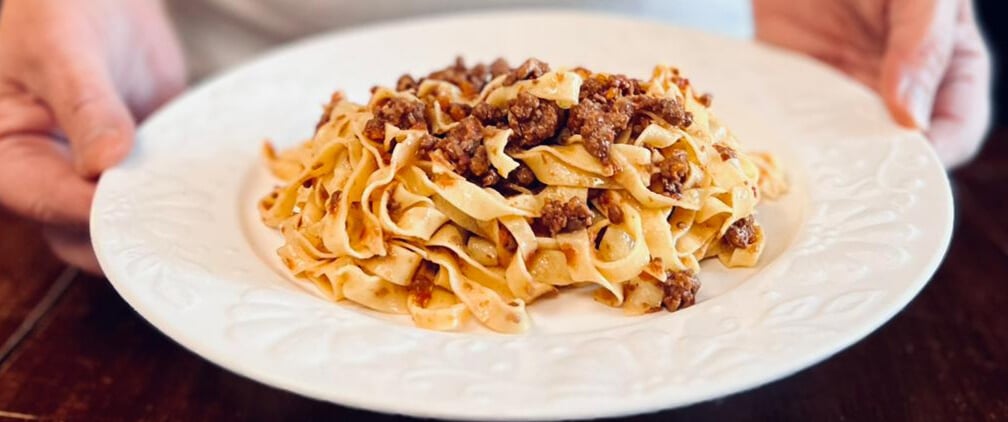 A plate of tagliatelle al ragù by Alessandra Spisni.