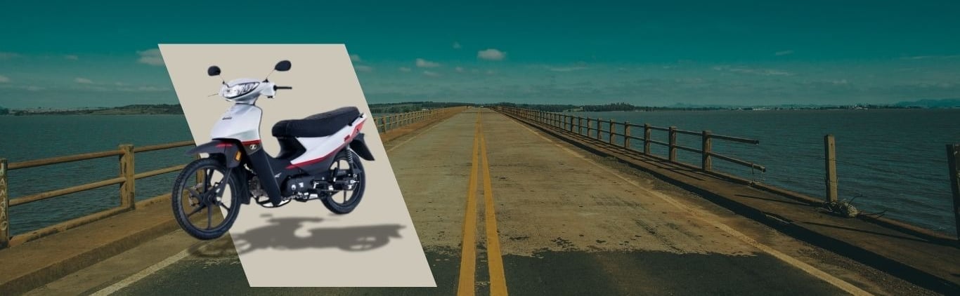a motorcycle parked on a bridge over a body of water