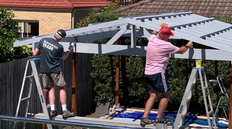 men working on a new pergola 