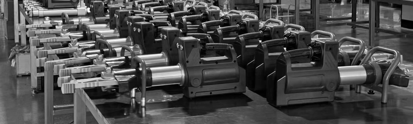 Rescue and breaching tools staged for assembly inside the factory workshop