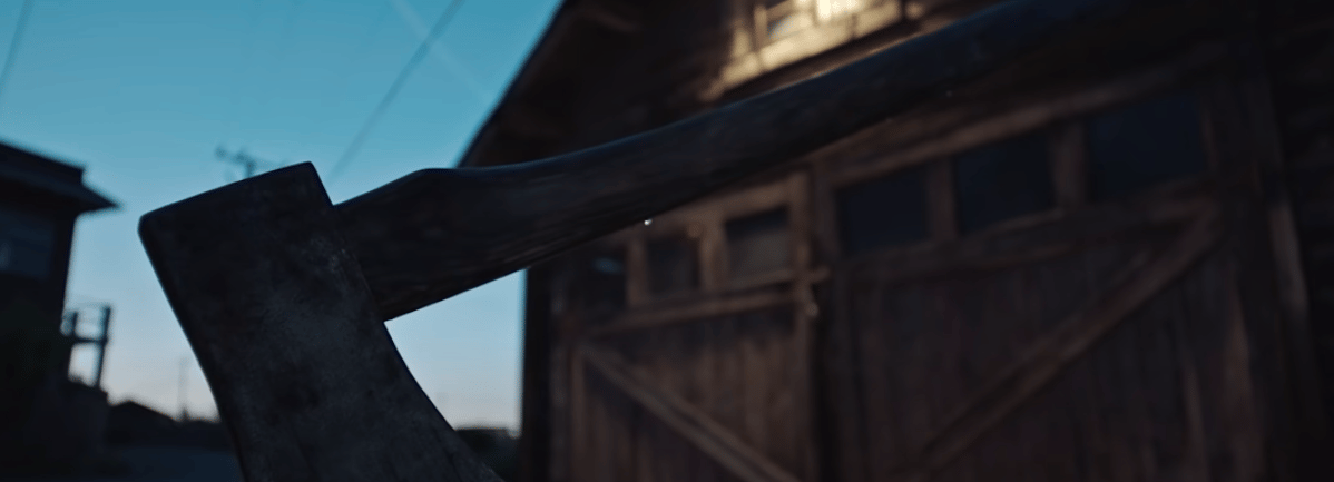 Axe in chopping block from the movie The Boy Behind The Door