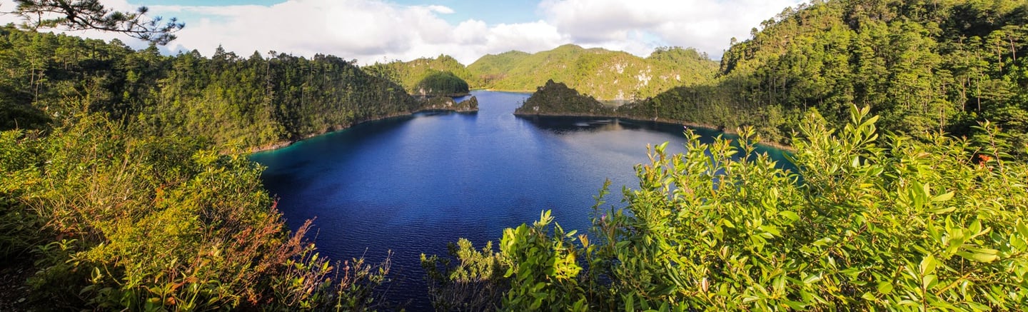 A panoramic view of the Montebello Lakes with crystal clear blue water in Chiapas Mexico