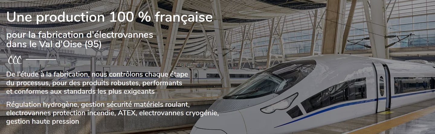 Un train à grande vitesse dans une gare moderne, illustrant la fabrication française d'électrovannes