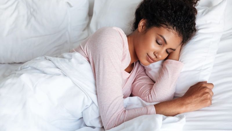 lady who is using the Breathbit and the nasivent in bed.