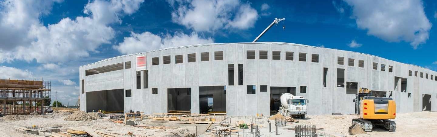 a construction site with a construction crane and a construction worker