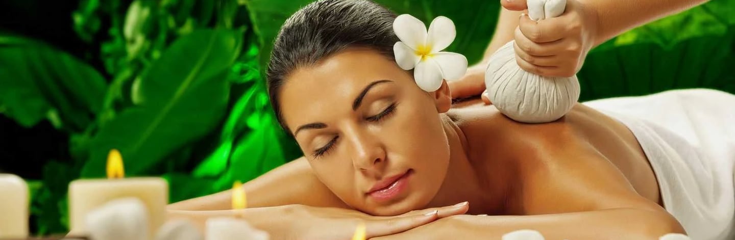 Professional therapist providing neck and shoulder massage at a spa in Perumbakkam