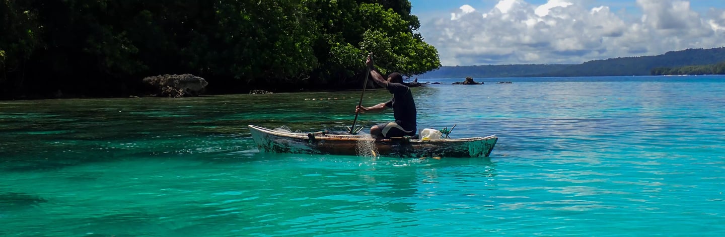 a man in a canoe in the water