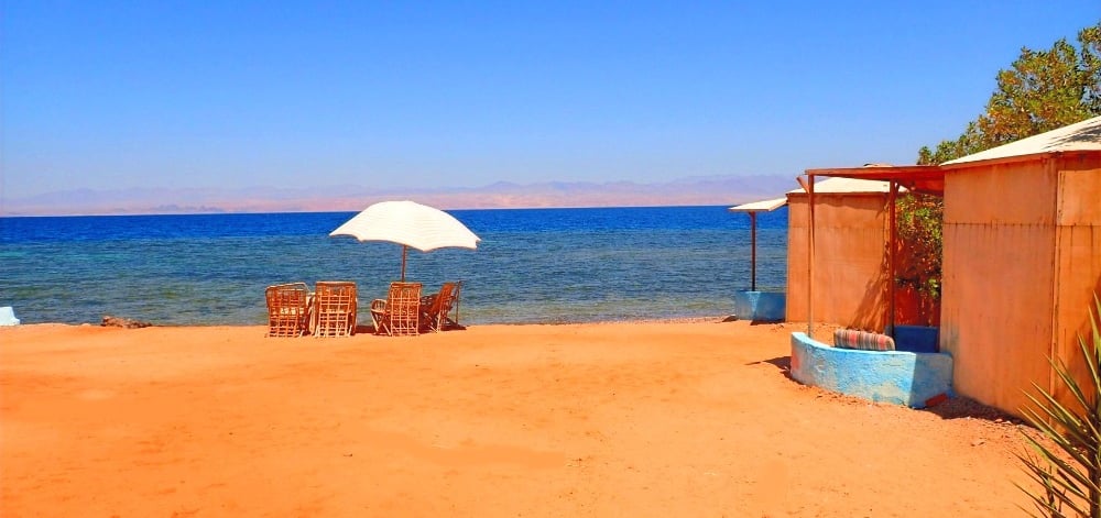 Bedouin star beach with chairs and umbrellas on the sand