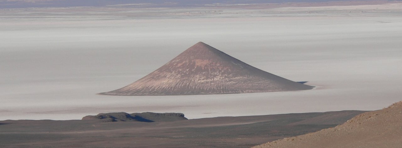 a mountain view of a mountain range with a mountain in the background cono de arita puna atacama sal