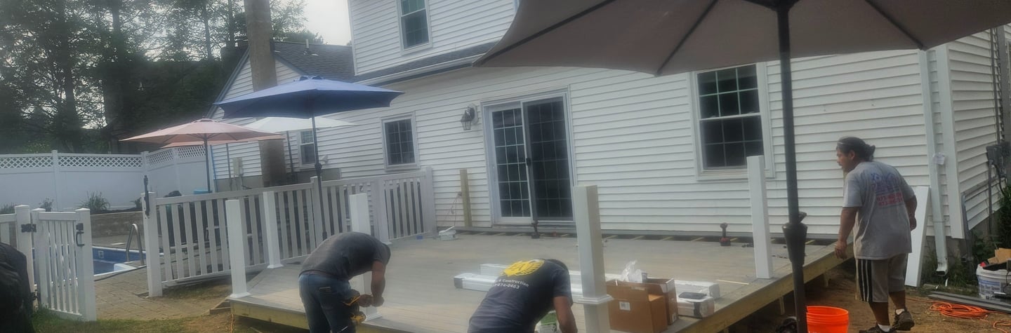 a group of people standing around a deck