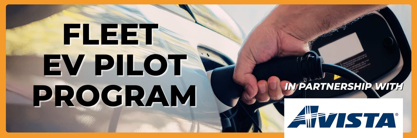 A hand plugs a charger into an electric car for a Fleet EV Pilot Program with Avista.