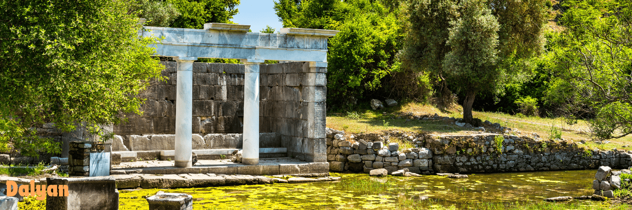 a stone building with a bench in an ancient city