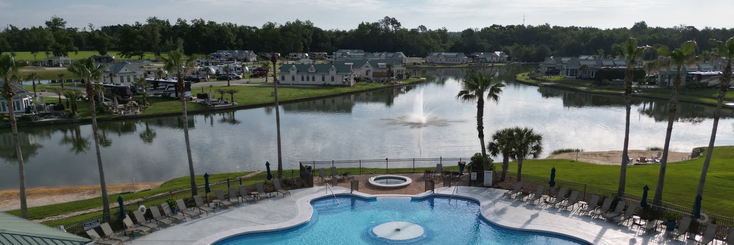 Resort ammenities and spring fed lake overlooking upsale community home and RV sites
