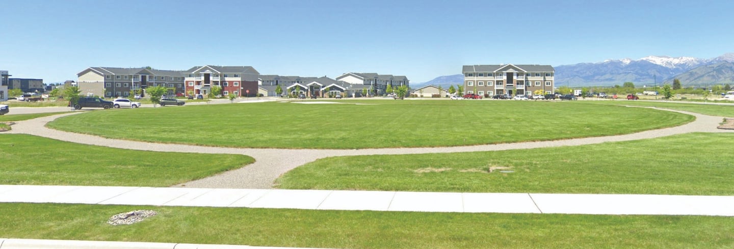 a park with a circular shaped lawn and a circular shaped lawn