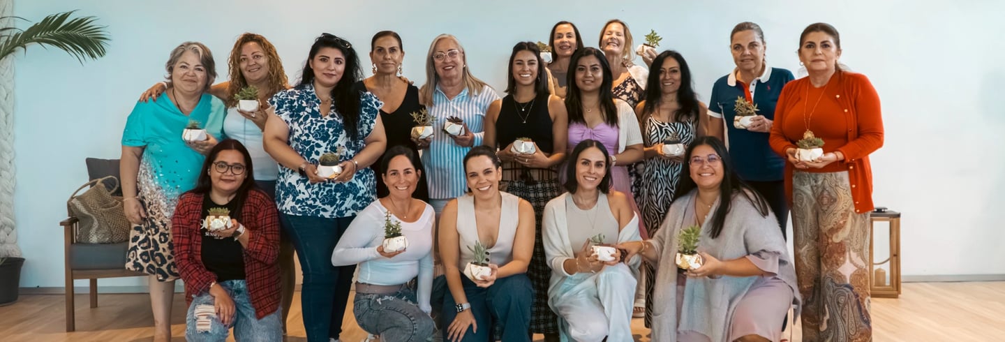 a group of women who are posing for a group photo