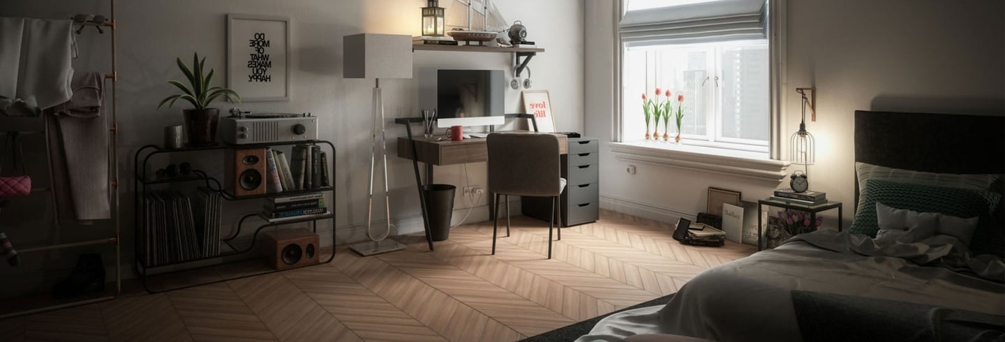 Modern studio apartment with a desk, record player, and herringbone wood floor by a window.