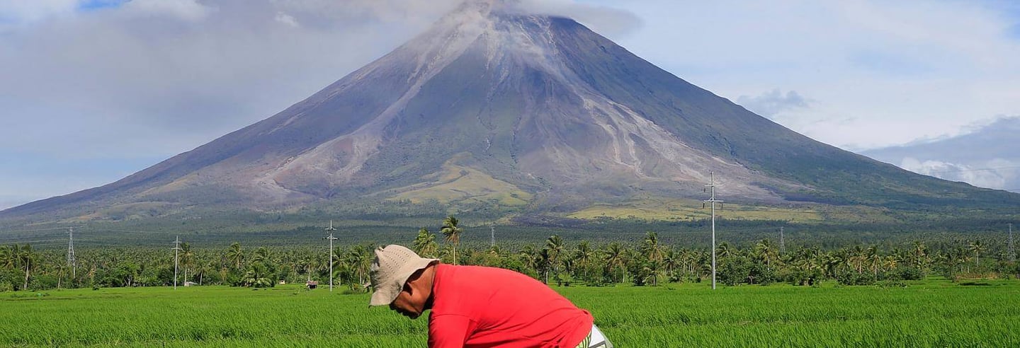 Farmer Mayon Volcano in Background