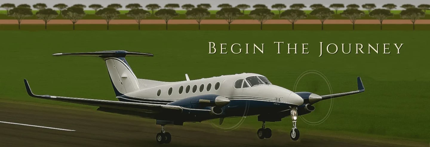 twin engine plane taking off on a sealed airstrip with green paddocks around
