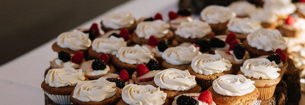 Selection of cupcakes shown as part of a rustic dessert bar in Bozeman Montana