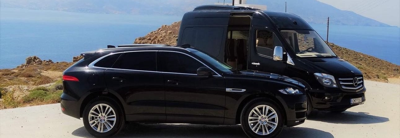 a van parked on a hill with a lighthouse in the background