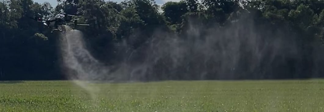 Hutch Drone Pro flying dji t40 crop spraying drone over corn