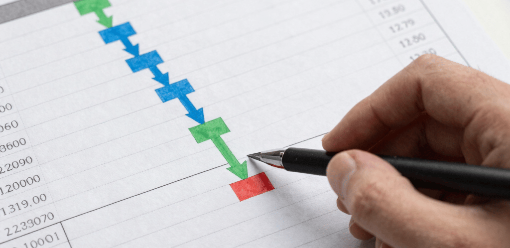 A friendly professional woman at a desk ready to assist with legal and financial advice.