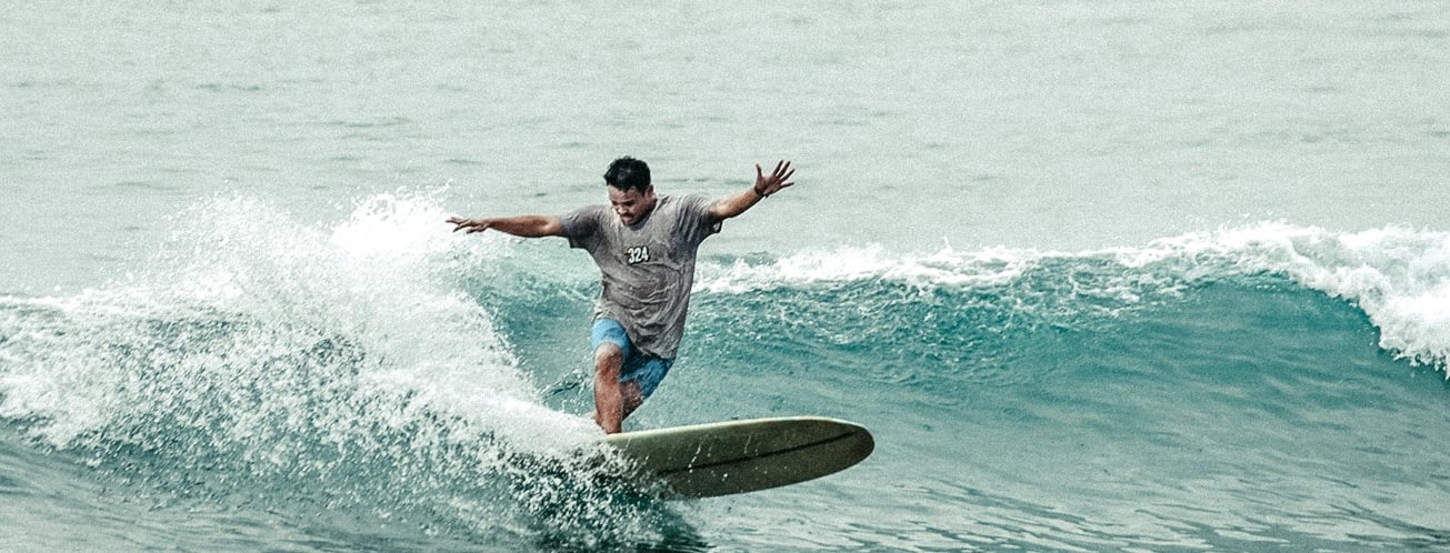 Ucup batukaras longboard surf lessons