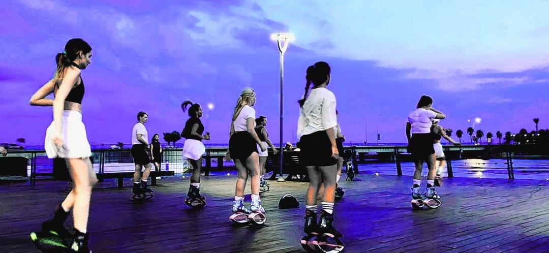 a group of women kangoo jump in KLCC