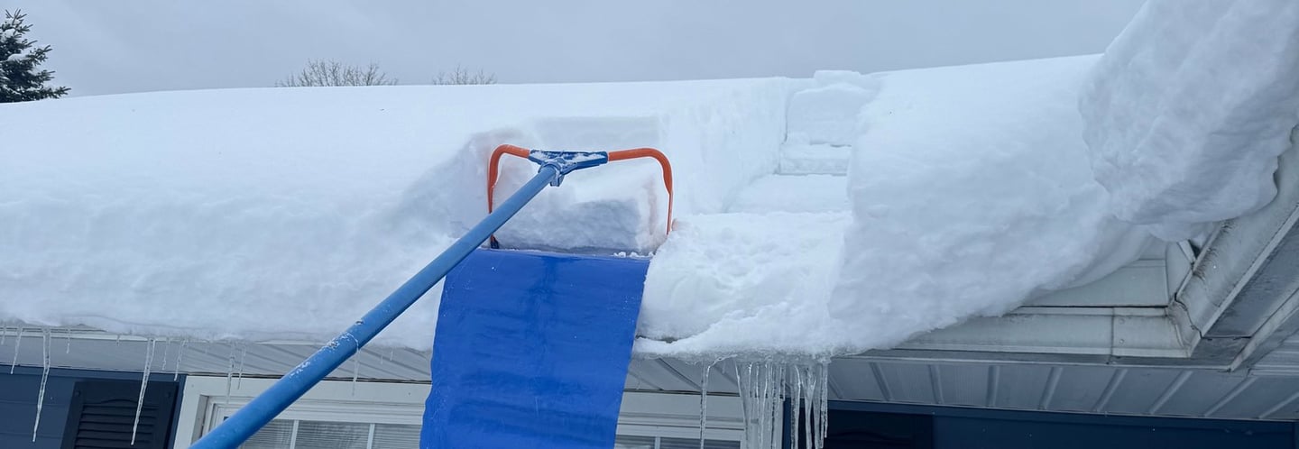 A roof being shoveled