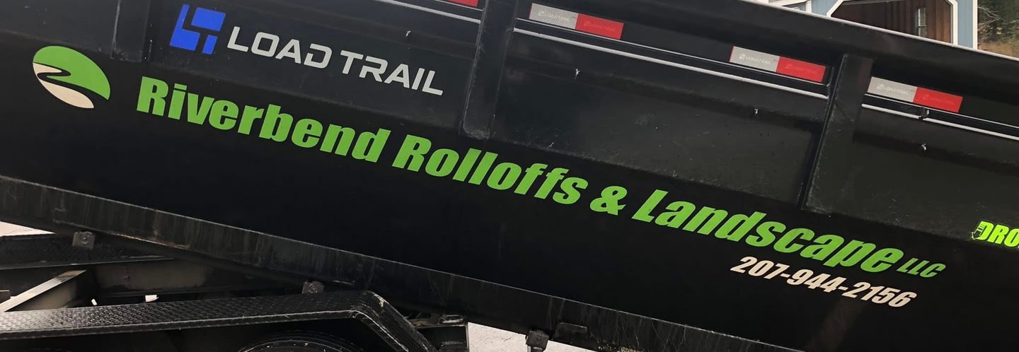 Black Load Trail dump trailer for Riverbend Rolloffs and Landscape equipment hauling.