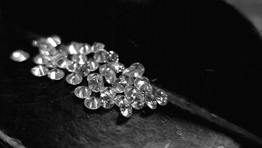 a bunch of CVD Lab-Grown Diamonds on a black and white background