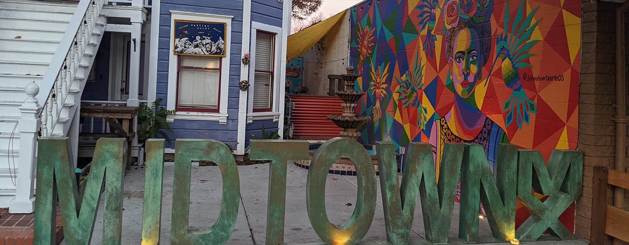 artistic photo capture of a sign that reads "midtown"