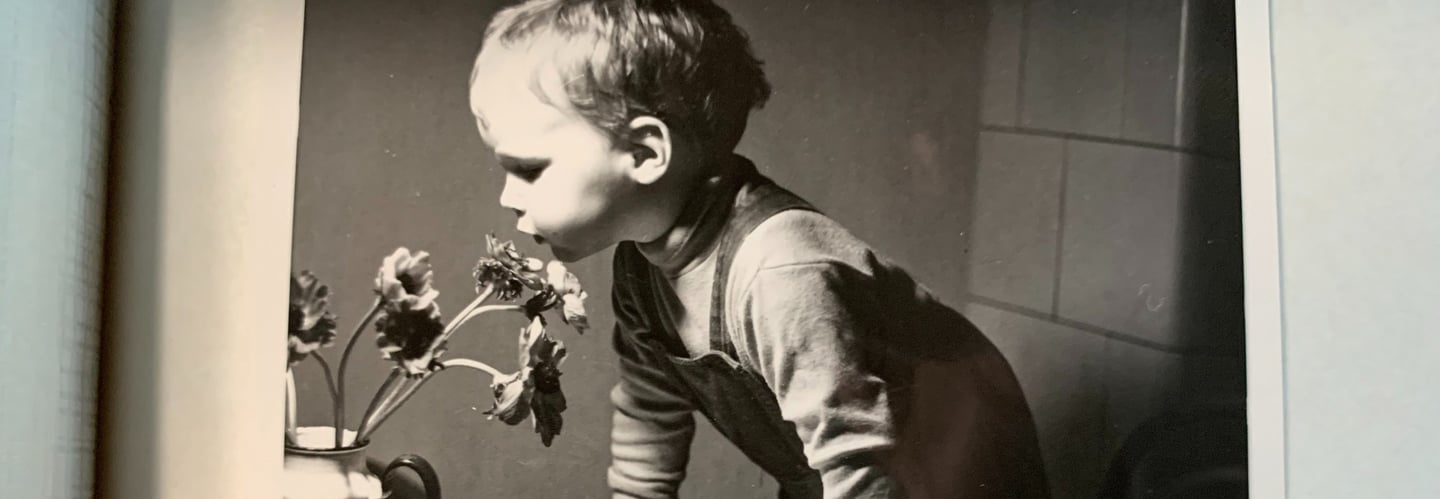 a young boy is shown in this black and white photo