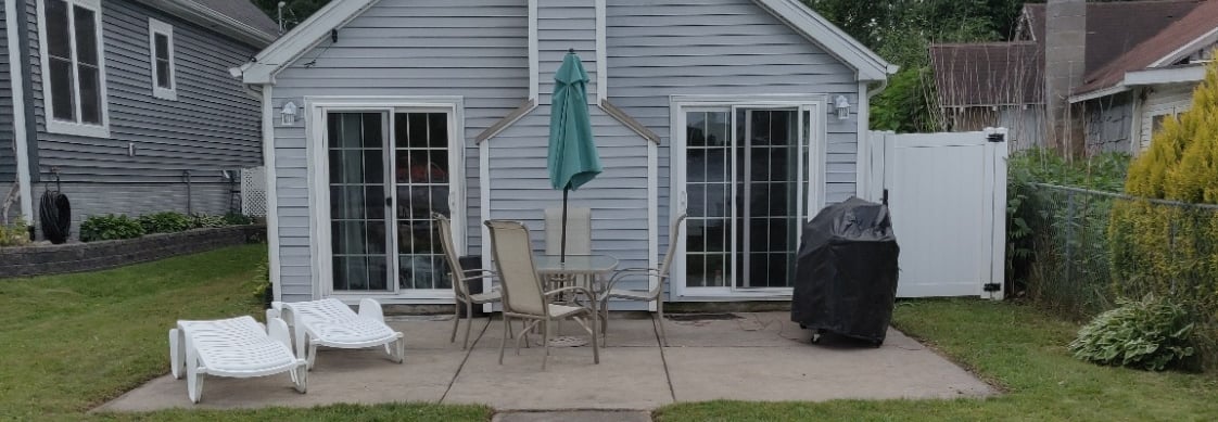 rear of cottage relax lakeside lake views southern michigan vrbo airbnb dock short term rental